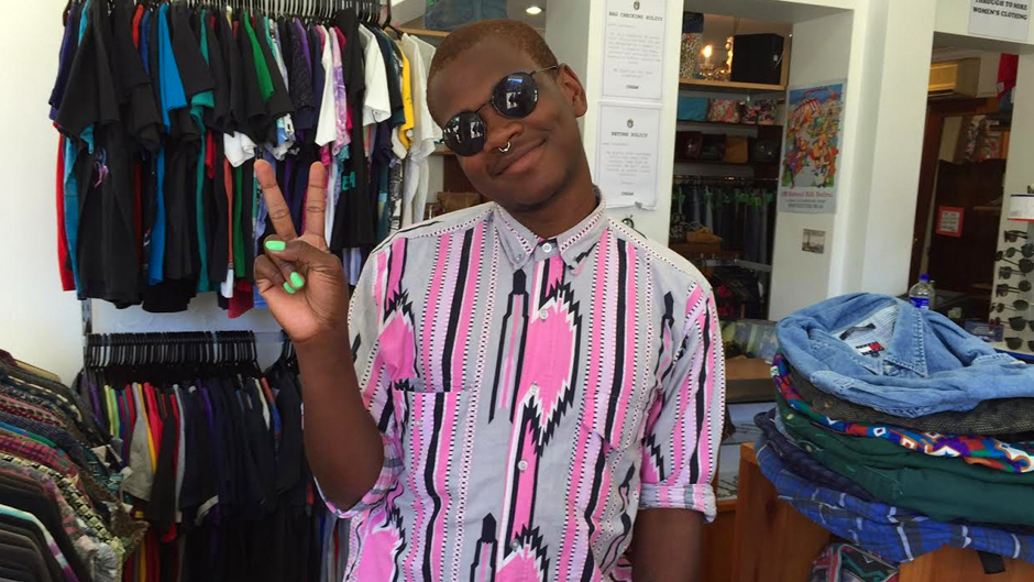 Androgynous artist Shamir Bailey poses in a graphic button down shirt.