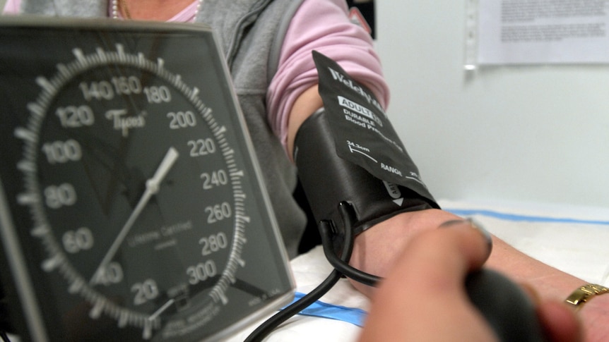 a person getting their blood pressure taken