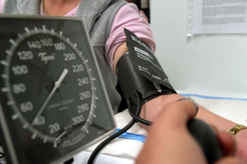 a person getting their blood pressure taken