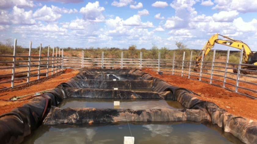 Evaporation ponds filled with brine at site of potash mine near Newman