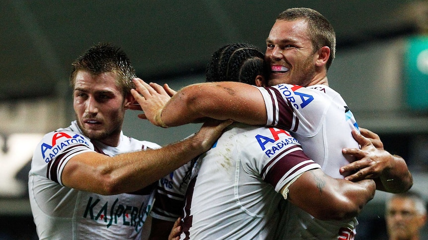 Manly's Chesye Blair is congratulated after scoring a try against the Sydney Roosters.