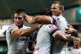 Manly's Chesye Blair is congratulated after scoring a try against the Sydney Roosters.