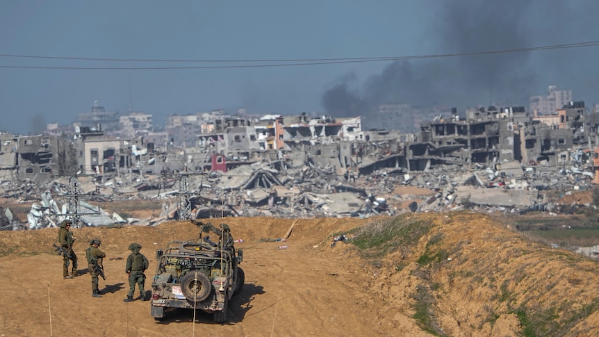 Israeli army troops are seen near the Gaza Strip border.