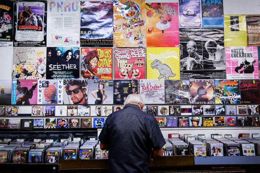 A man flicking through the CD collection at Lawson's record store in Sydney.