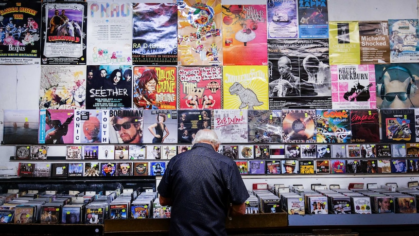 A man flicking through the CD collection at Lawson's record store in Sydney.