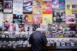 A man flicking through the CD collection at Lawson's record store in Sydney.