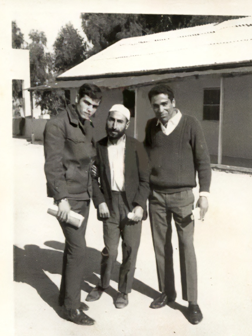 Old black and white photo of three men.