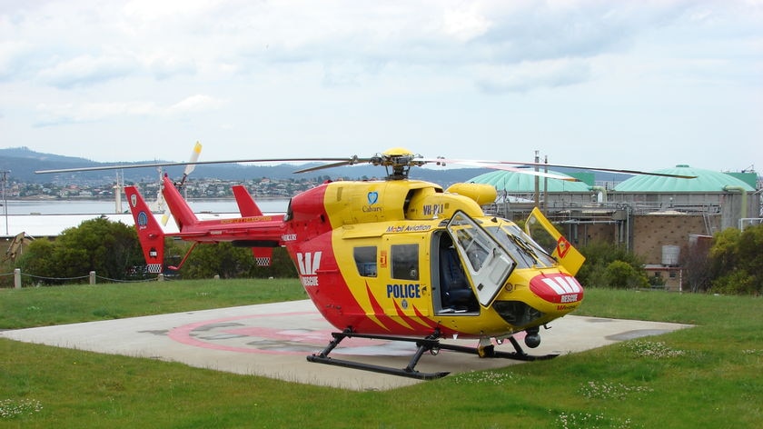 The rescue helicopter lands at Hobart Cenotaph about a kilometre from the Royal Hobart Hospital.