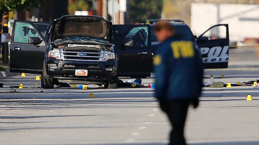 A member of the FBI walks around in San Bernardino.