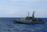 HMAS Wollongong approaches asylum seeker boat