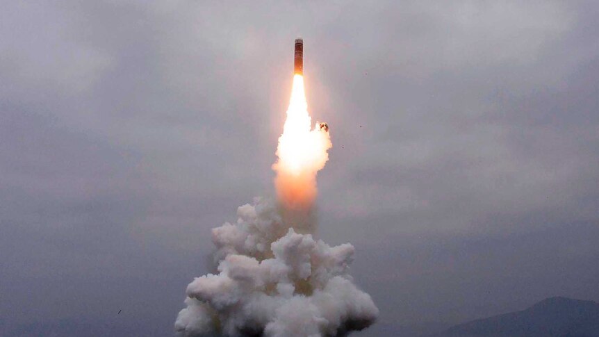 A missile is launched from underwater.