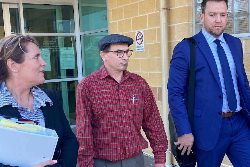 Three people outside the Victor Harbor courthouse.