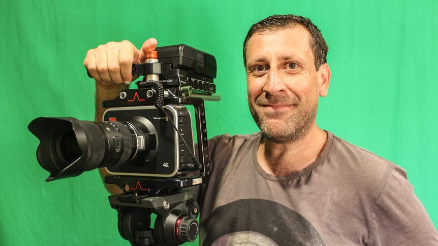Peter Renzullo behind his camera