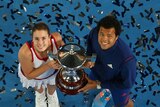 France's Alize Cornet and Jo-Wilfried Tsonga pose with the Hopman Cup trophy after beating Poland.