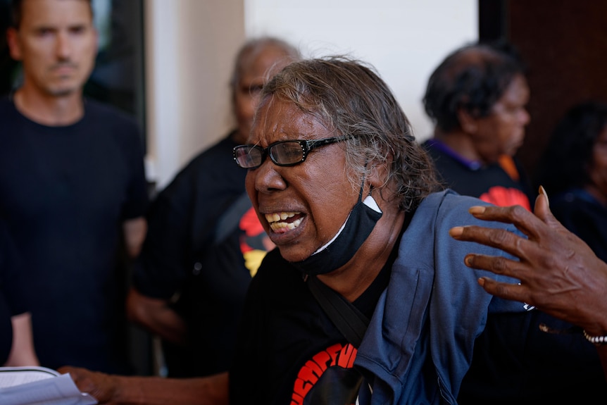 Valerie Napaljarri Martin, deputy chair of the Parumpurru Justice Committee, crying outside the NT Supreme Court