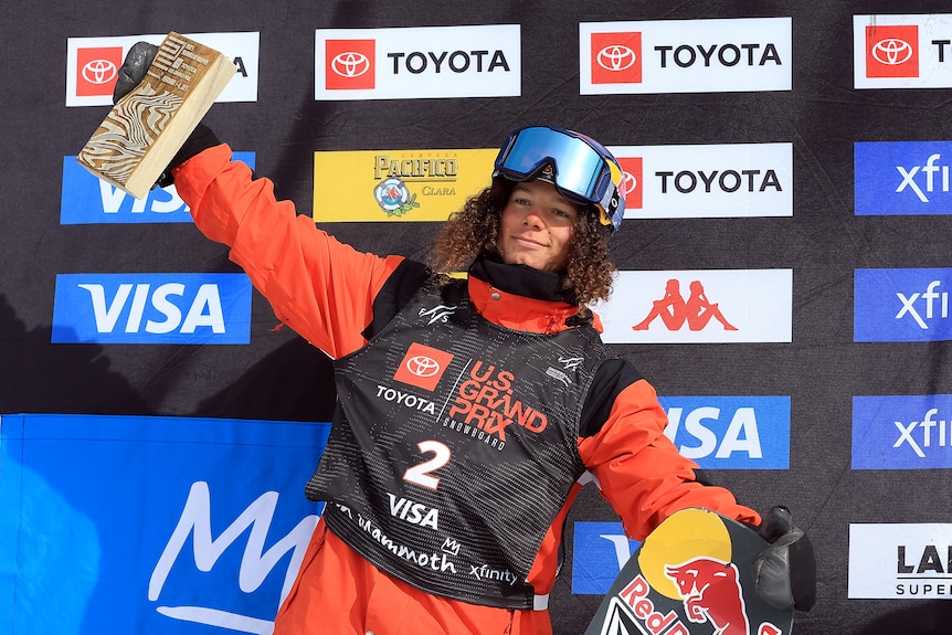 Val Guseli holds up a trophy