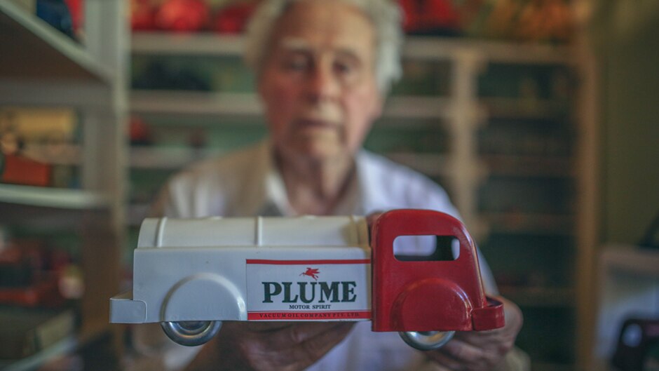 Jack Little the toy collector with a vintage oil truck from his collection.