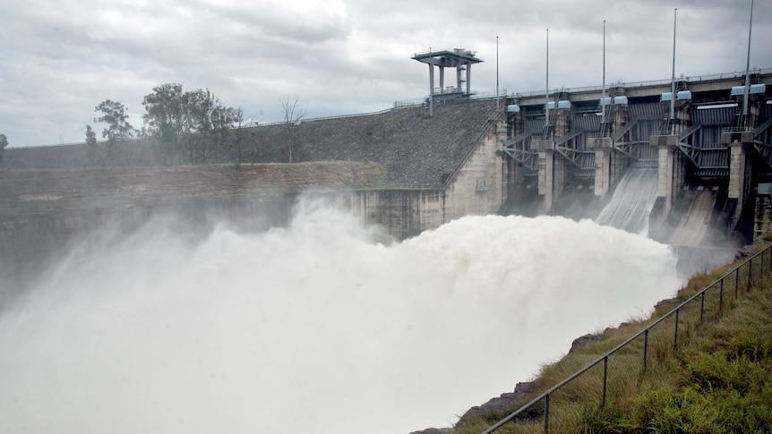 Water pours down the spillway at Wivenhoe Dam in October 2010.