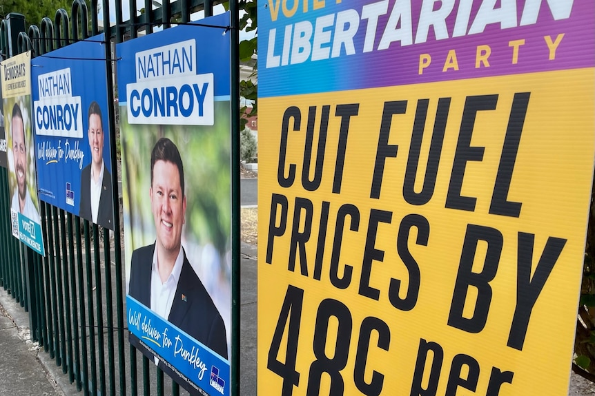 Political signs on a fence