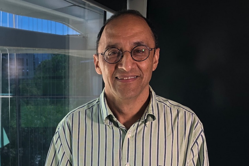 Smiling photo of Dr Pankaj Sah.