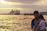 Father and son frolic in Port Phillip Bay