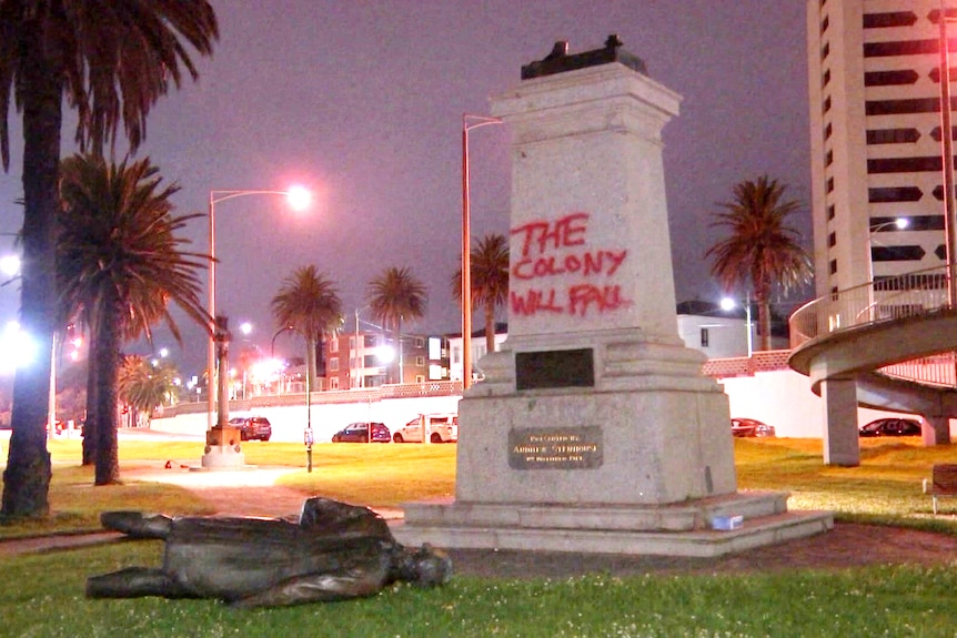 A bronze statue of Captain Cook has been sawn off at the legs, and the plinth daubed with 'the colony will fall'.