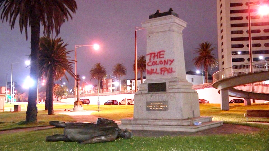 A bronze statue of Captain Cook has been sawn off at the legs, and the plinth daubed with 'the colony will fall'.