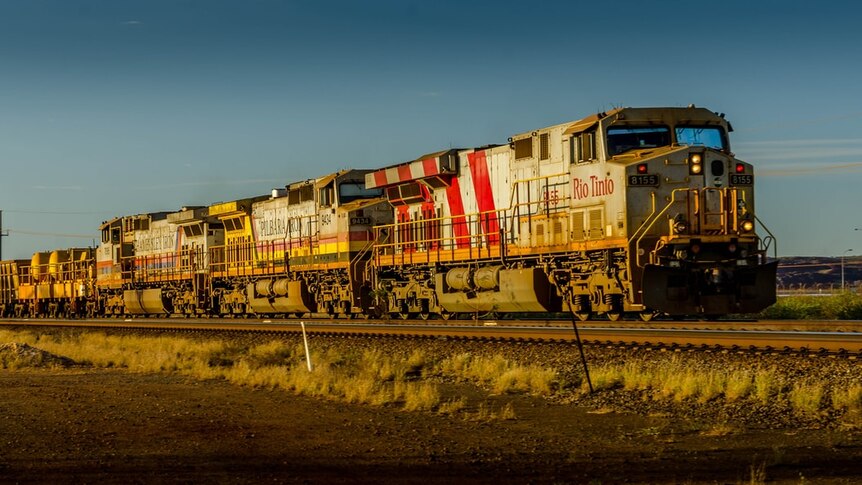 rio tinto train driving through pilbara