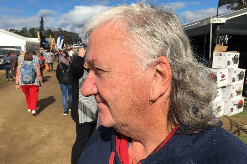 A man wearing a mullet.