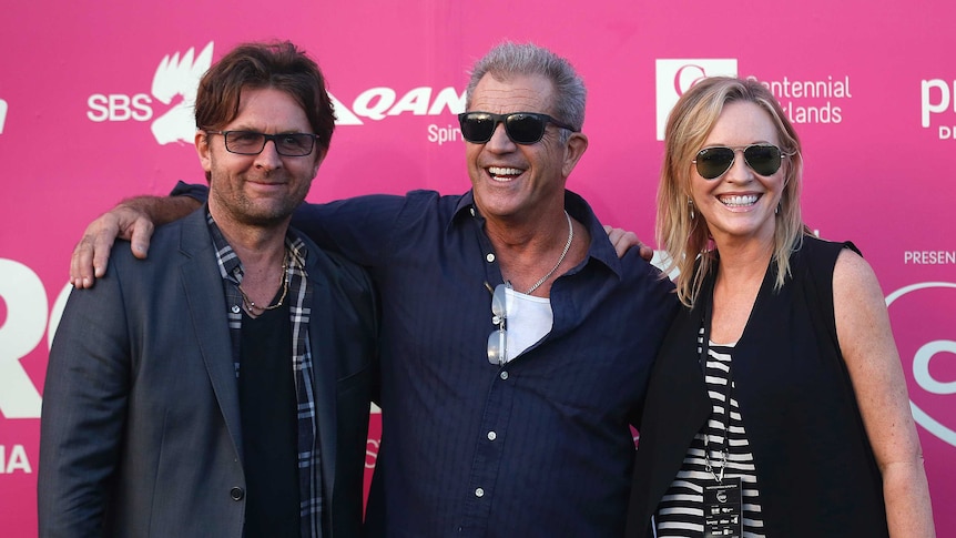 Actor Mel Gibson (centre) poses for photographers with John Polson (left) founder of Tropfest and actress Rebecca Gibney.