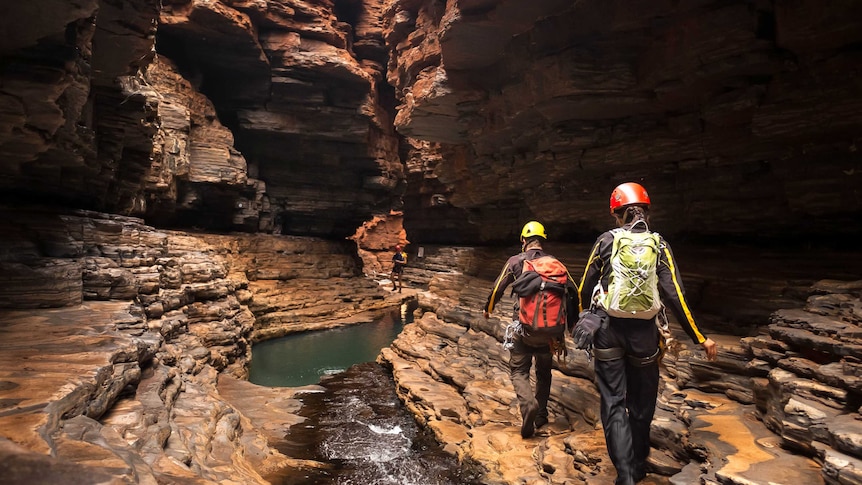 A tour group in Karijini walks through spectacular caves