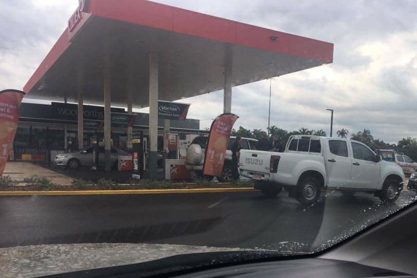 Police with an allegedly stolen Toyota Prado at a service station in Palmerston