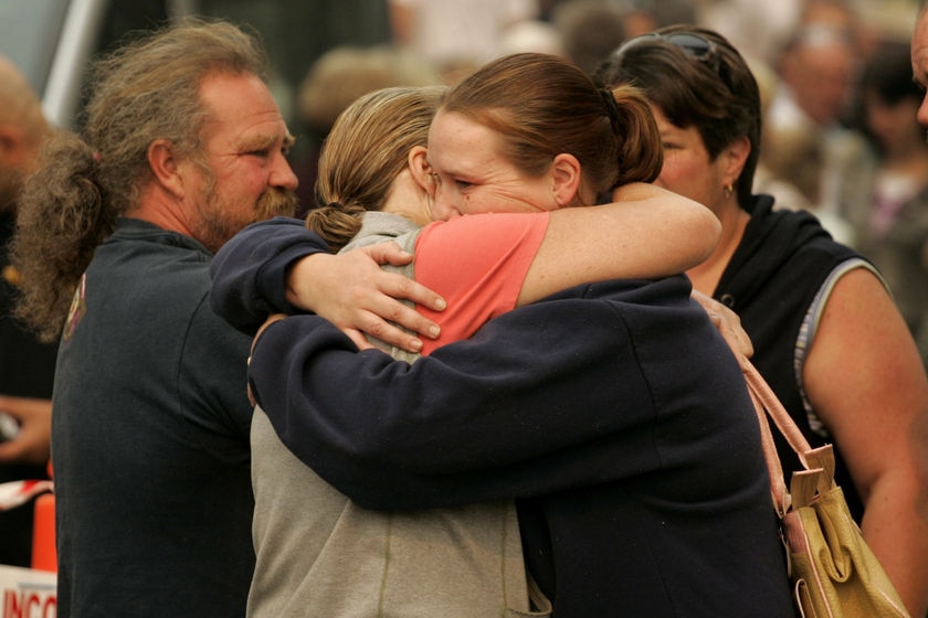 Marysville residents greet each other before touring their fire-ravaged town.