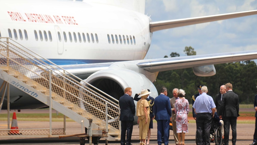 Prince Charles shakes hands with Chief Minister Michael Gunner as he steps off the plane.