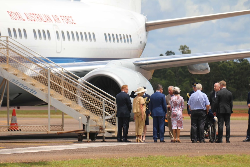 Prince Charles shakes hands with Chief Minister Michael Gunner as he steps off the plane.