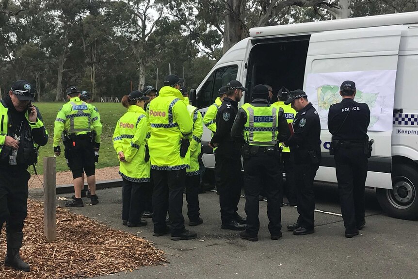 Police assemble ahead of search