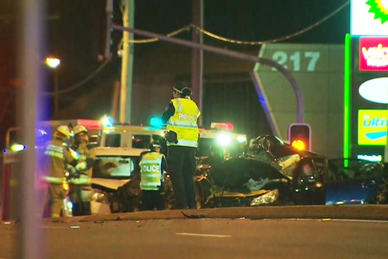 Police at the scene of a multi-vehicle crash in Brisbane's inner north.