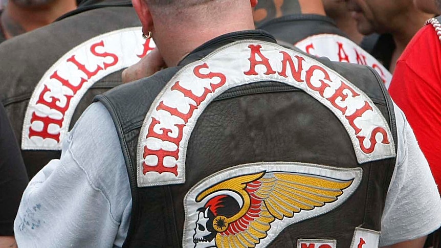 Hell's Angels members stand outside court