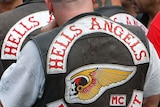 Hell's Angels members stand outside court
