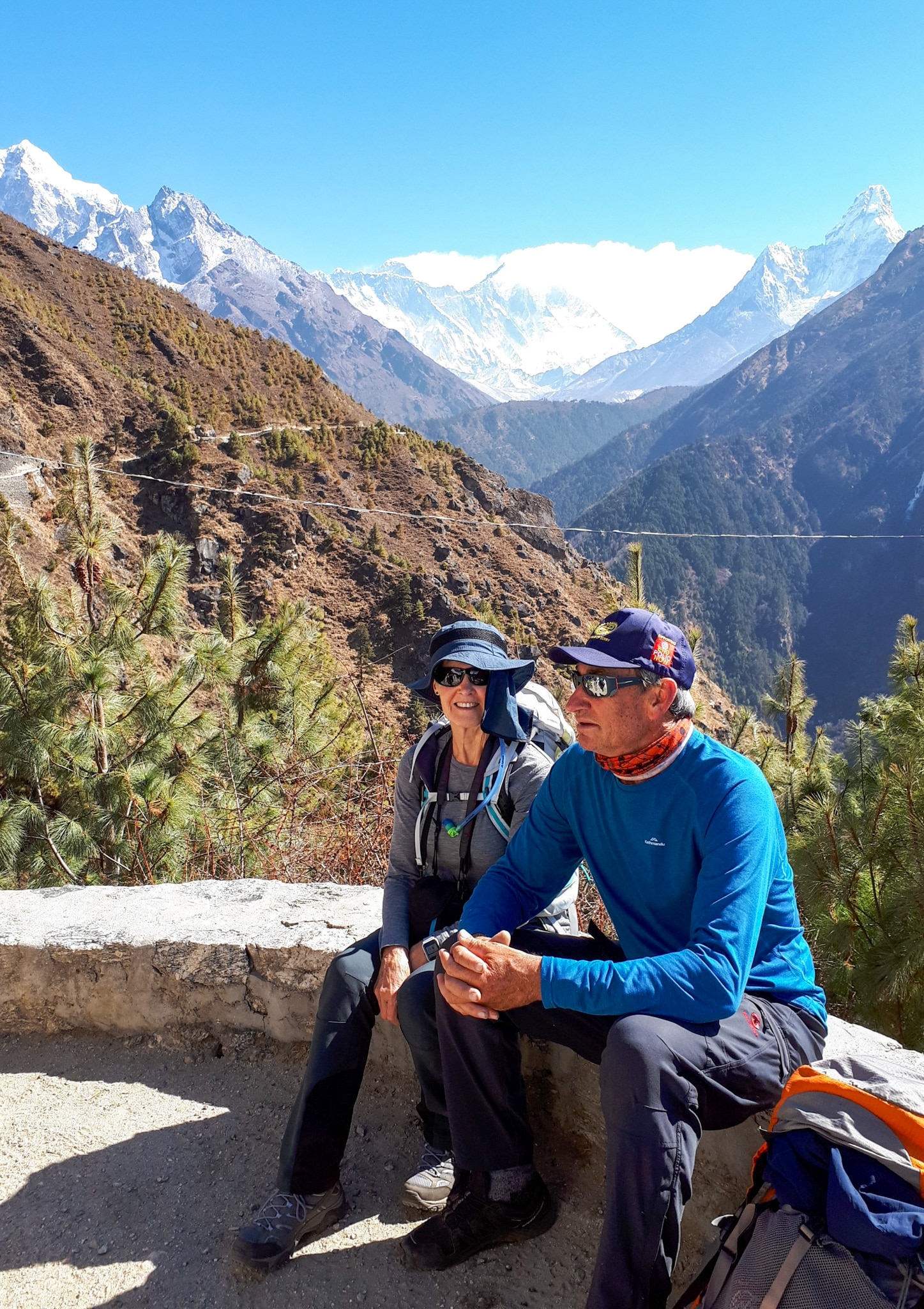 Two hikers rest on the trek to Mt Everest. 