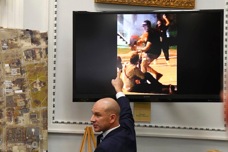 A lawyer points to an image showing Kyle Rittenhouse shooting Gaige Grosskreutz.