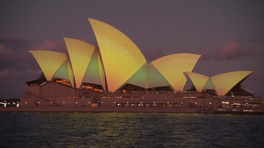 Sydney Opera House lit up in Green and Gold