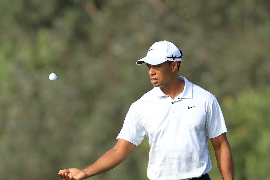 Tiger Woods plays a tee shot on his way to a 5-under-par 67 The Lakes.