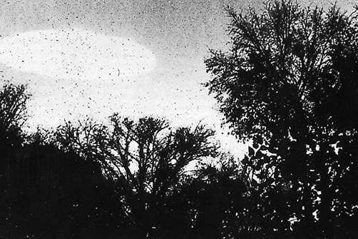 Black and white photo reportedly showing the shadow of a UFO
