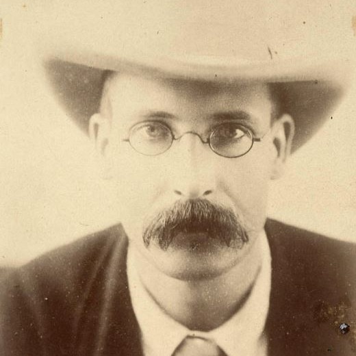 old photo man in a hat and glasses