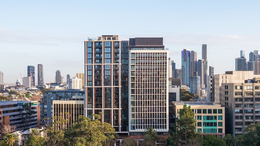 A high-rise building in Melbourne is pictured from a distance, among the horizon of skyscrapers.