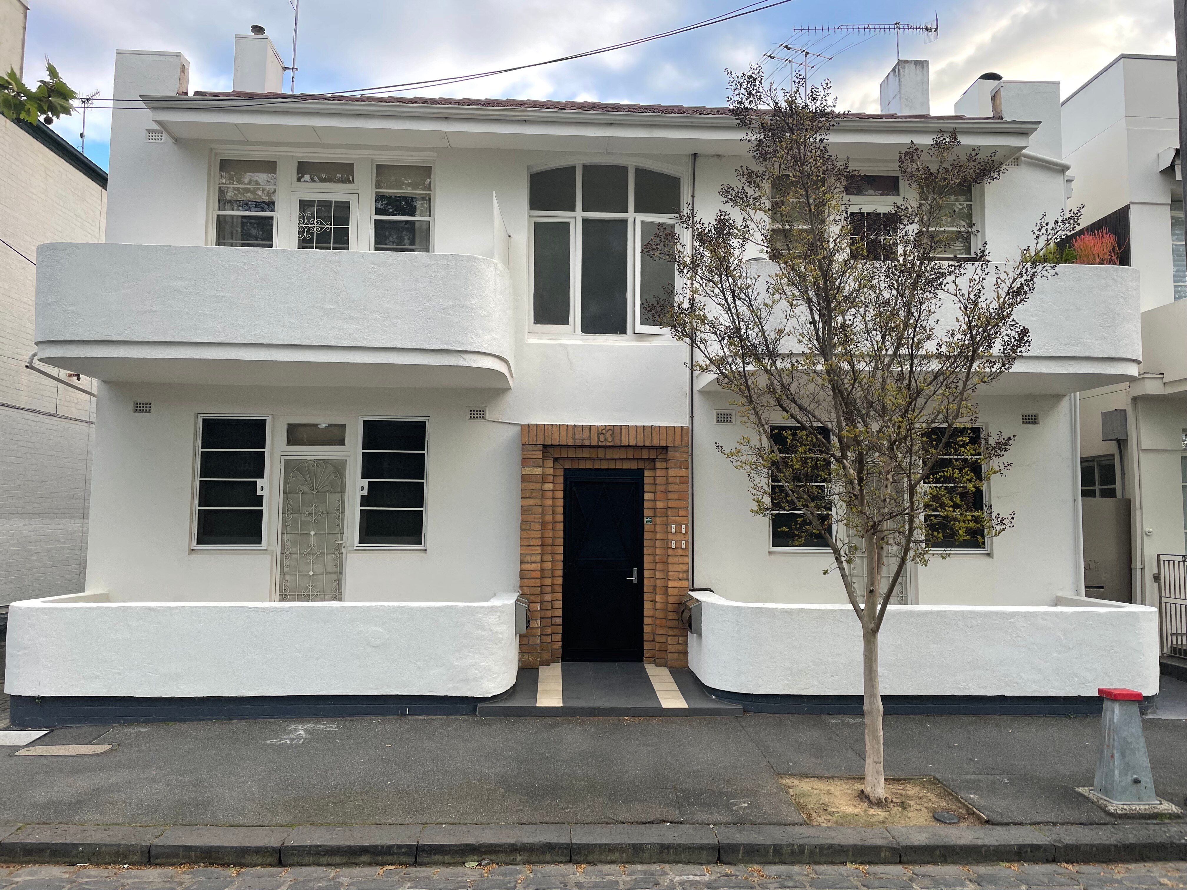 An early 1900s design units, white with curved balconies