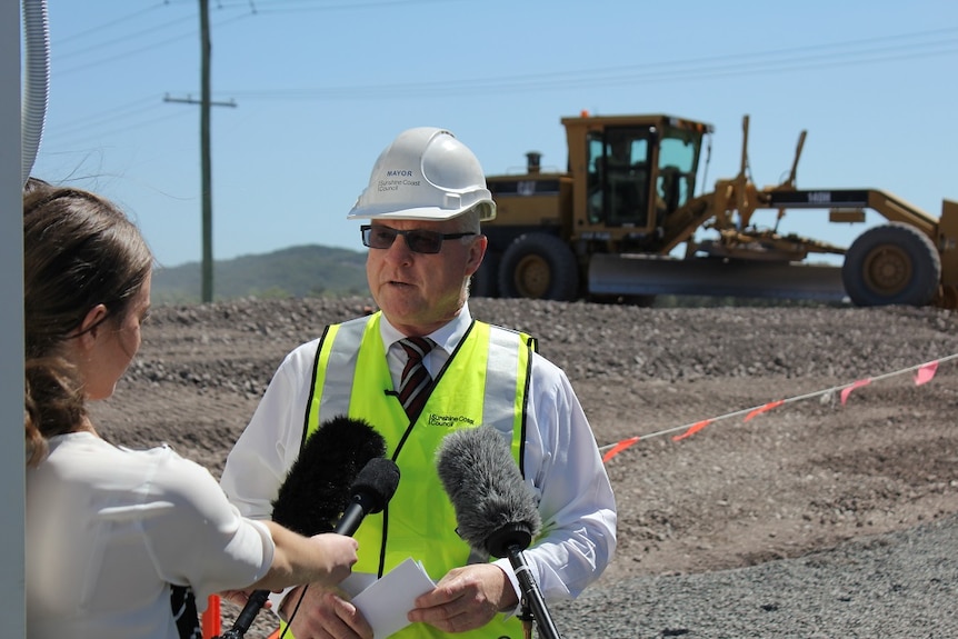 Sunshine Coast Mayor Mark Jamieson briefs journalists at the solar farm site this morning.