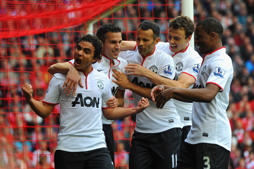Anfield surge ... Rafael celebrates his equaliser against Liverpool.
