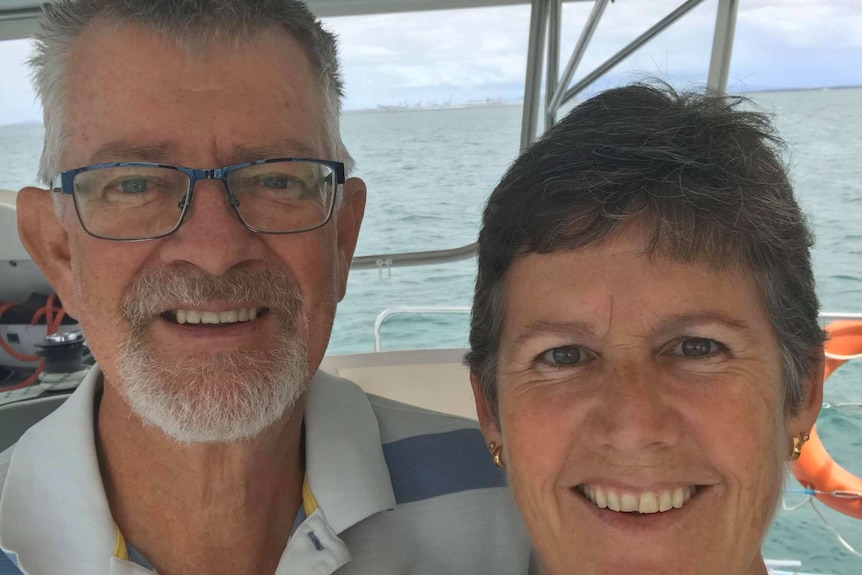 A man and woman's faces on a boat